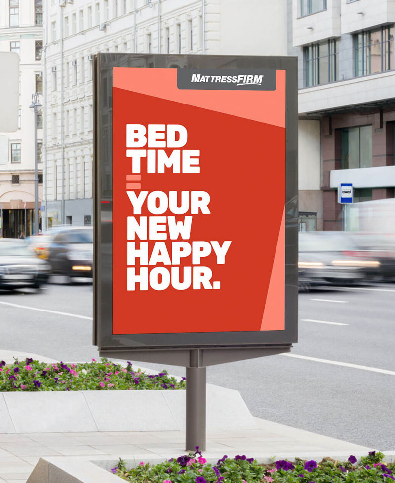 Mattress Firm Signage on a busy street.