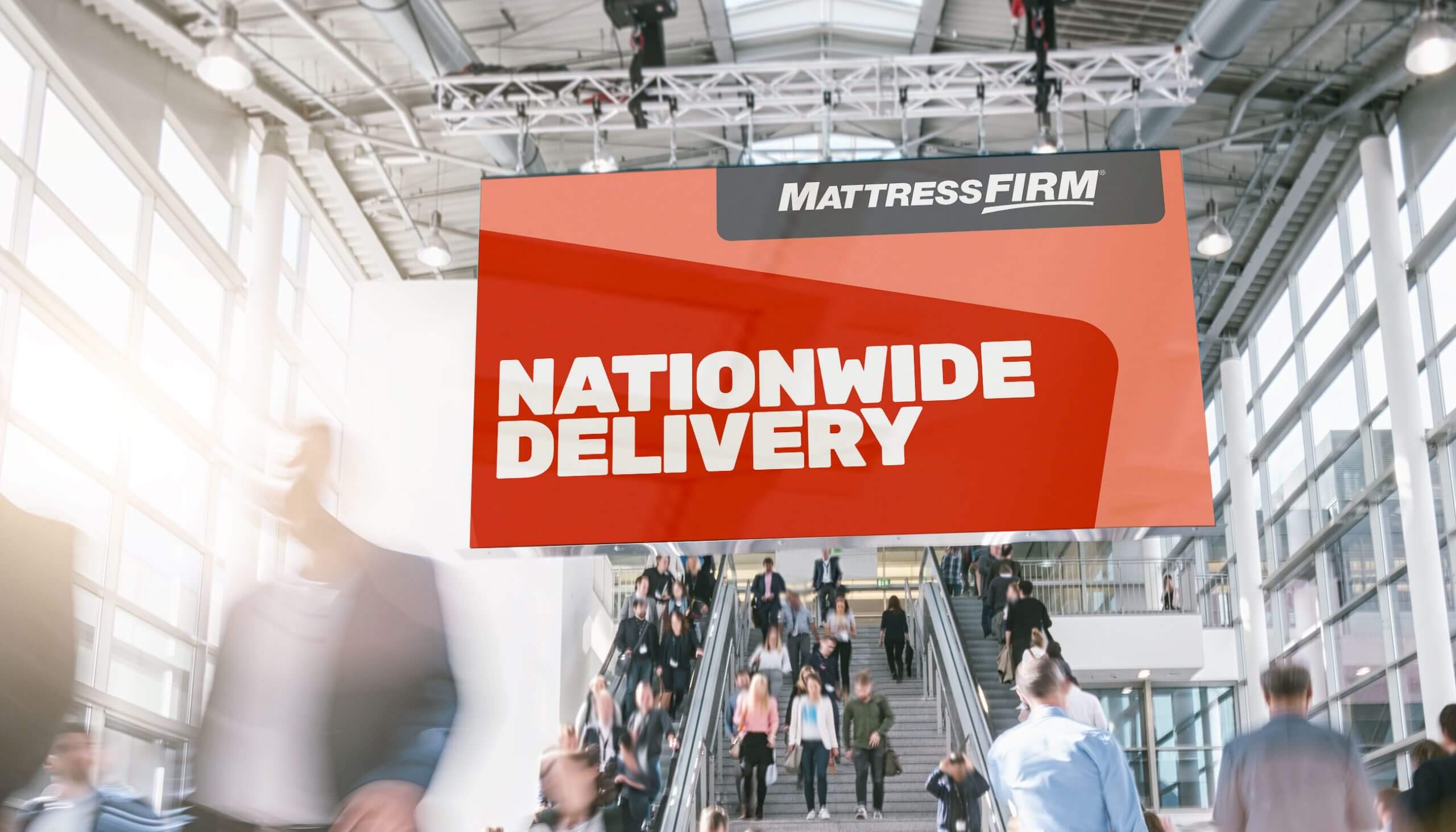 Mattress Firm Signage At A Busy Transit Station